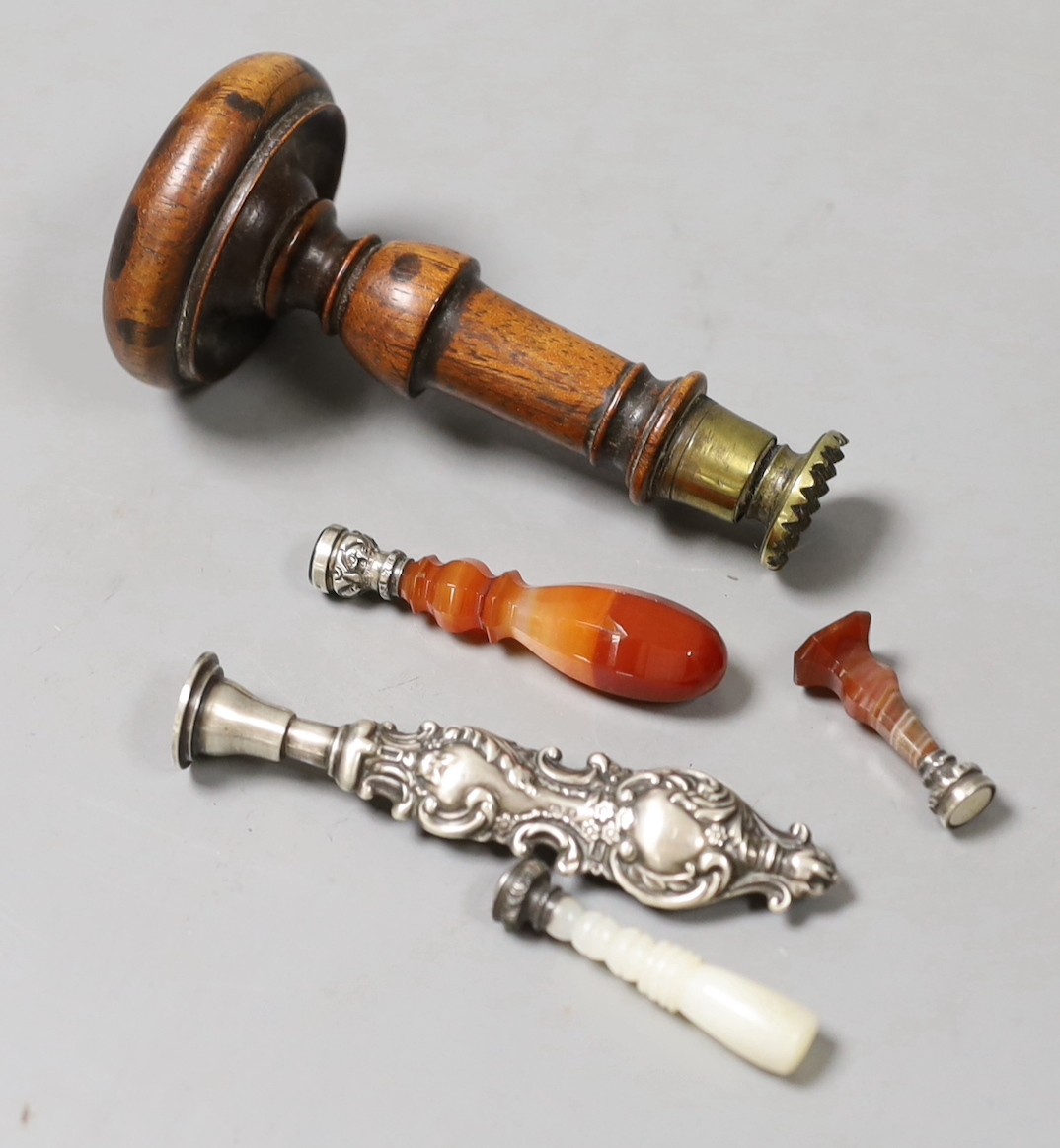 Four 19th century decorative handled seals and a larger wooden handles seal-9cms long